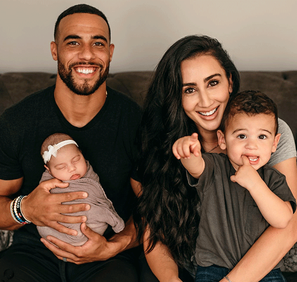 Micah Hyde with his wife and children